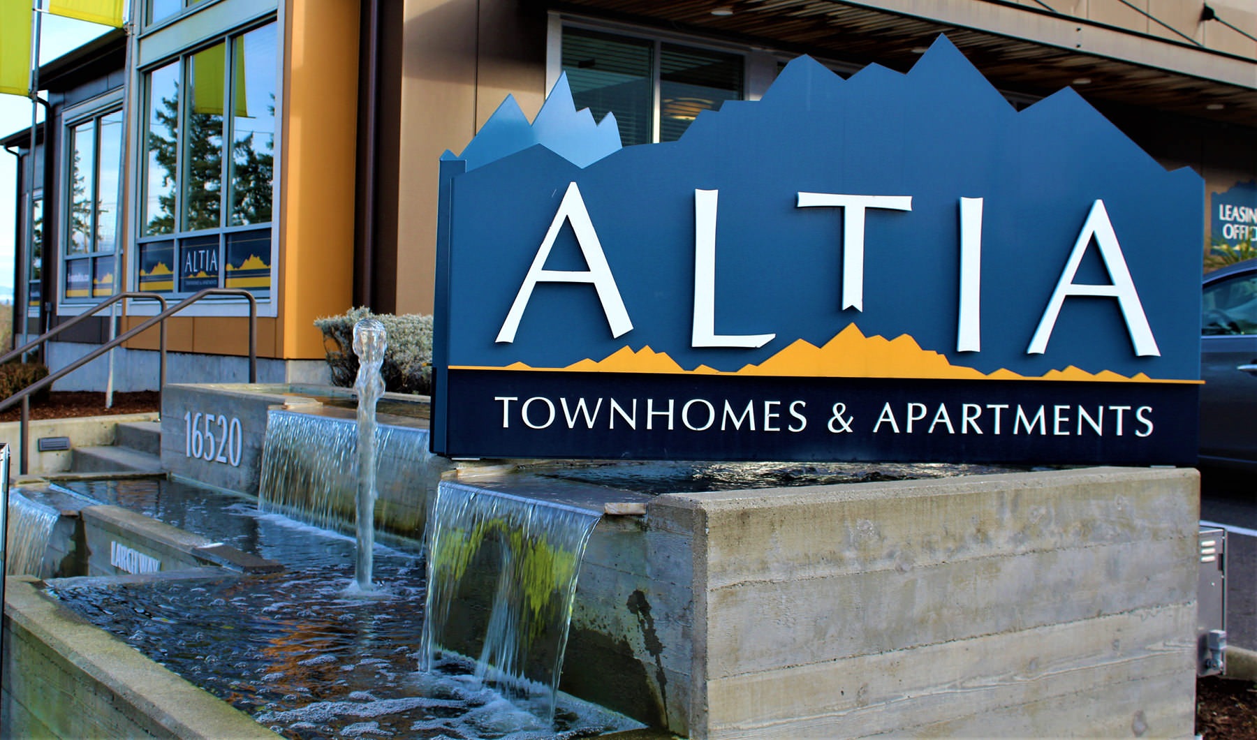 Altia signage surrounded by water features at office entrance